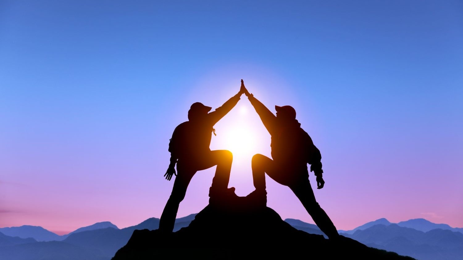 Success mountain high-five