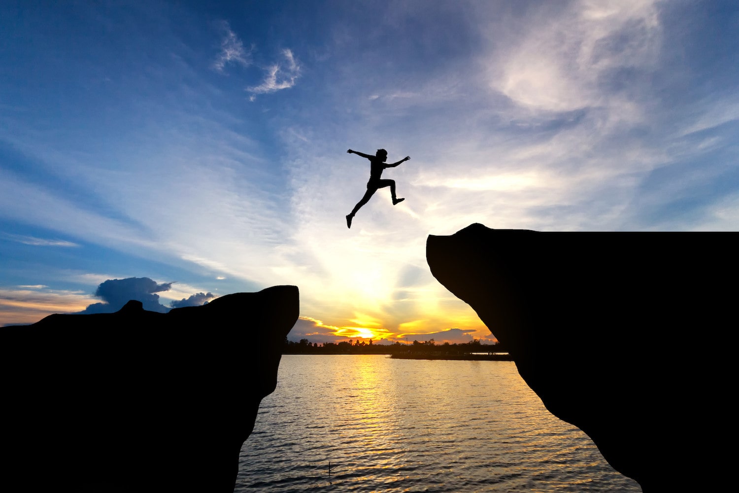 Boy jumping over gap